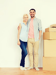 Image showing couple with cardboard boxes moving to new home