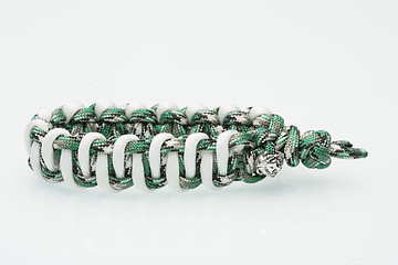 Image showing green braided bracelet on white background