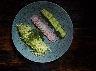 Image showing Fresh spring light vegetarian salad with cucumber and radish