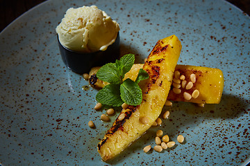 Image showing Grilled pineapple with vanilla ice cream