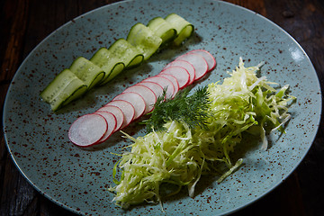 Image showing Fresh spring light vegetarian salad with cucumber and radish