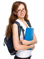 Image showing Young student girl is holding book