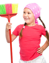 Image showing Young girl is dressed as a cleaning maid