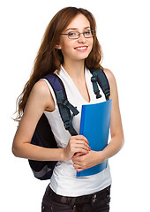 Image showing Young student girl is holding book