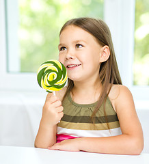 Image showing Little girl with lollipop