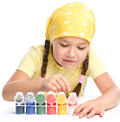 Image showing Cute thoughtful child play with paints