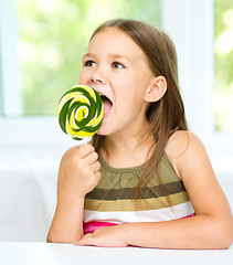 Image showing Little girl with lollipop