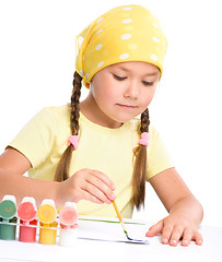 Image showing Cute thoughtful child play with paints