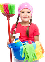 Image showing Young girl is dressed as a cleaning maid