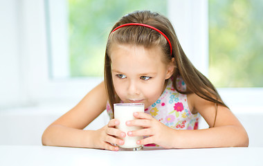 Image showing Little girl with a glass of milk