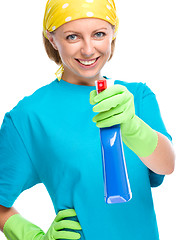 Image showing Young woman holding cleaning spray