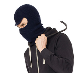 Image showing Thief with metal crowbar