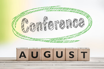 Image showing August conference sign on a scene