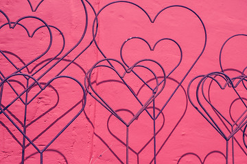 Image showing Hearts decoration at a violet wall