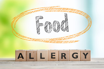 Image showing Food allergy sign on a table