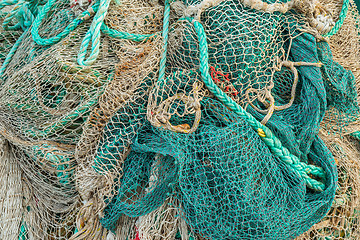 Image showing Fishing net by a harbor