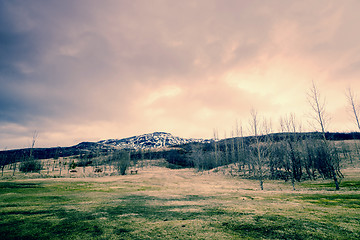 Image showing Distant mountain with a grass field