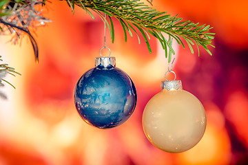 Image showing Shiny xmas baubles on a tree