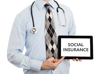 Image showing Doctor holding tablet - Social insurance