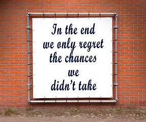 Image showing Large banner with inspirational quote on a brick wall
