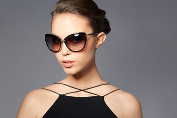 Image showing beautiful young woman in elegant black sunglasses