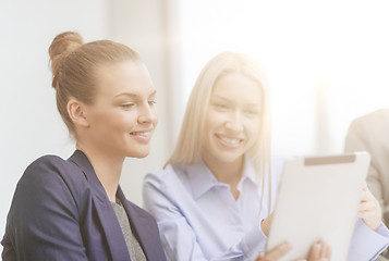 Image showing business team with tablet pc having discussion