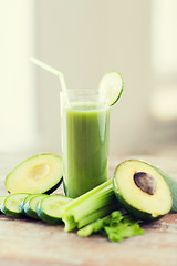 Image showing close up of fresh green juice glass and vegetables