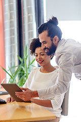 Image showing happy creative team with tablet pc in office