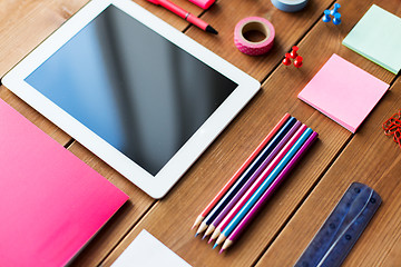 Image showing close up of school supplies and tablet pc