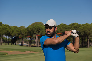 Image showing golf player hitting shot