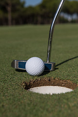 Image showing hitting golf ball to hole