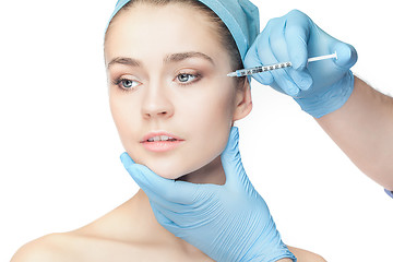 Image showing Attractive woman at plastic surgery with syringe in her face