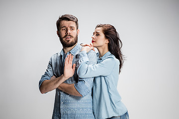 Image showing The young couple with different emotions during conflict