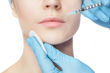 Image showing Attractive woman at plastic surgery with syringe in her face