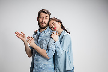 Image showing The young couple with different emotions during conflict