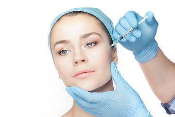 Image showing Attractive woman at plastic surgery with syringe in her face