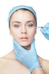 Image showing Attractive woman at plastic surgery with syringe in her face