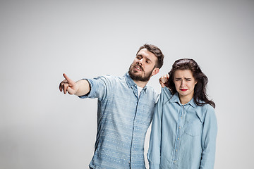 Image showing The young couple with different emotions during conflict