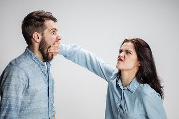 Image showing The young couple with different emotions during conflict