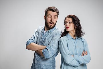 Image showing The young couple with different emotions during conflict