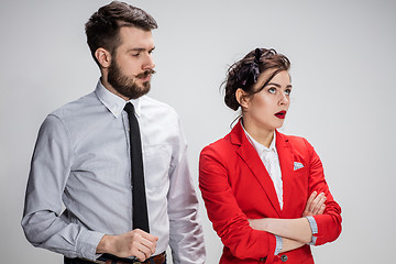 Image showing The business man and woman communicating on a gray background