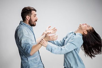 Image showing Portrait of happy couple on gray background