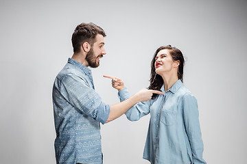 Image showing The young couple with different emotions during conflict