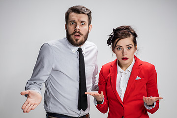 Image showing The business man and woman on a gray background