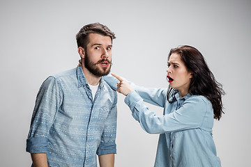 Image showing The young couple with different emotions during conflict