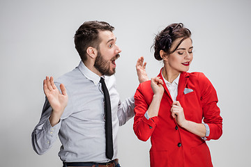 Image showing The business man and woman communicating on a gray background