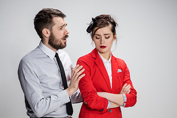 Image showing The business man and woman communicating on a gray background