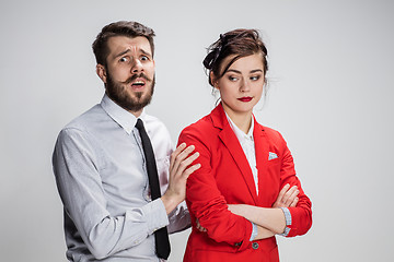 Image showing The business man and woman communicating on a gray background