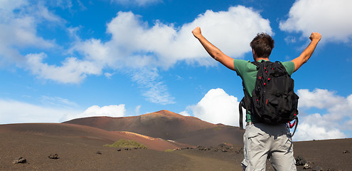 Image showing Man reaching the top of mountain.