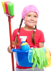 Image showing Young girl is dressed as a cleaning maid